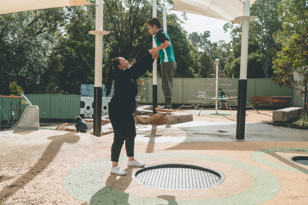 Student using the trampoline in the playground